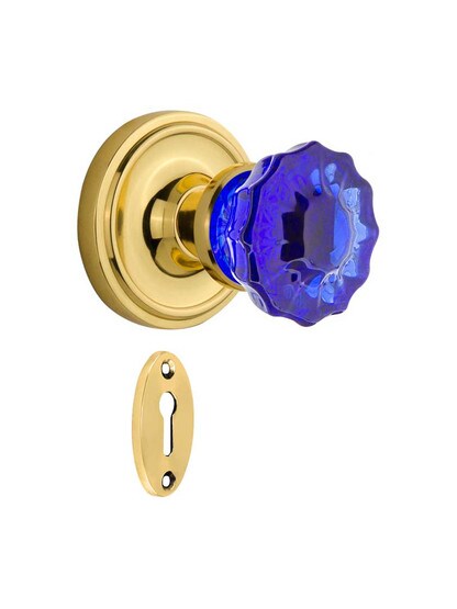 Classic Rosette Mortise Lock Set with Colored Fluted Crystal Glass Knobs Cobalt Blue in Polished Brass.